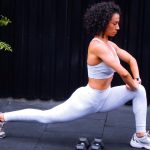 Woman performing lunges in outdoor gym setting in Ciudad de México